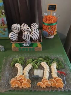 an assortment of fruits and vegetables on a table at a children's birthday party