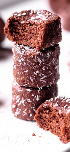 chocolate cookies stacked on top of each other with powdered sugar sprinkles