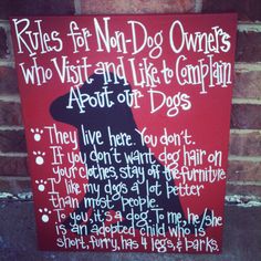 a sign on the side of a building that says rules for non - dog owners who visit and like to entertain about our dogs