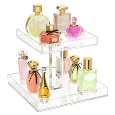 three tiered clear acrylic display with perfume bottles