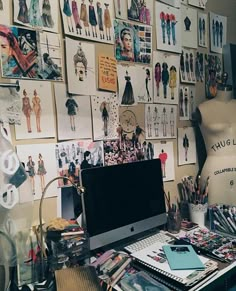 a desk with a computer on top of it next to a dressmaker's mannequin