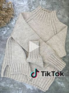 the sweater and gloves are knitted together