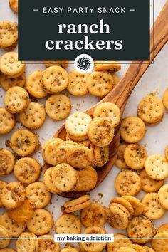 a wooden spoon filled with crackers on top of a table