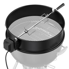 an outdoor bbq grill with tongs attached to it