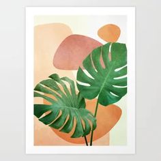 a large green leaf on top of a pink and orange background with an abstract design