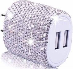 an electric charger with lots of diamonds on the front and back sides, all in white