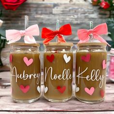 three jars with hearts and bows on them