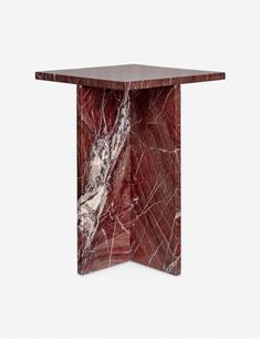 a small table with red marble on the top and white veining in the middle