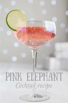 the pink elephant cocktail is garnished with lime