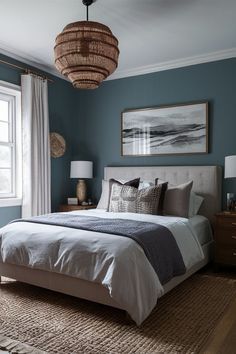 a bed sitting in a bedroom next to a window covered in pillows and blankets on top of a rug