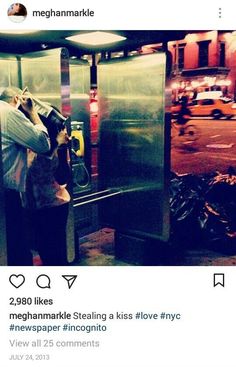 two people standing in front of a metal door