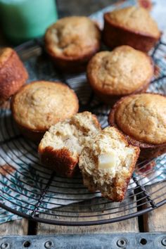 muffins cooling on a wire rack with one cut in half