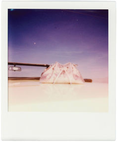 a pair of skis sitting on top of a snow covered ground