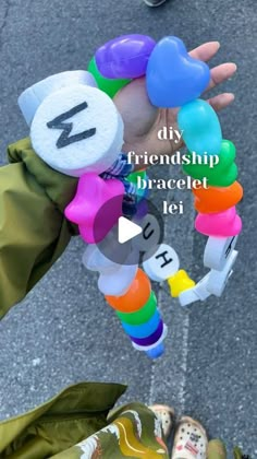 someone is holding up some colorful bracelets with numbers on them and the words diy,