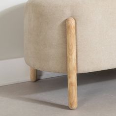 a wooden stick sticking out of the back of a couch