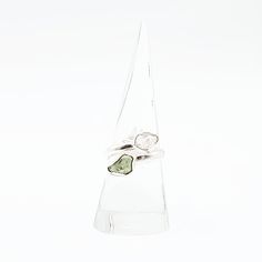 Divine Elegance Elevate your style with our exquisite Herkimer Diamond & Moldavite Ring, set in gleaming sterling silver. This stunning piece combines the celestial brilliance of Herkimer diamonds with the otherworldly energy of Moldavite, creating a ring that radiates elegance and power. Perfect for those who appreciate unique and spiritually significant jewelry, this ring is a true statement piece. Amplify Your Spiritual Journey Herkimer diamonds are renowned for their exceptional clarity and Fine Jewelry Peridot Rings With Brilliant Cut, Peridot Rings With Brilliant Cut In Fine Jewelry Style, Wedding Jewelry With Brilliant Cut Peridot, Luxury Sterling Silver Rings With May Birthstone, Modern Polished Rings With May Birthstone, Modern White Gold Rings With Si Clarity, Timeless Green Sterling Silver Ring, Modern Silver Gemstone For Anniversary, Modern Sterling Silver Stackable Rings With Brilliant Cut