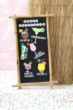 a chalkboard sign with some stickers on it