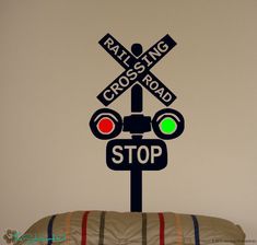 a railroad crossing sign with stop lights on it