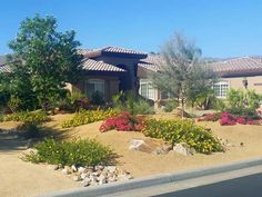 a house with landscaping in front of it