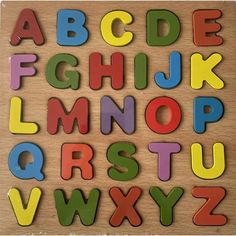 wooden letters and numbers are arranged in the shape of magnets