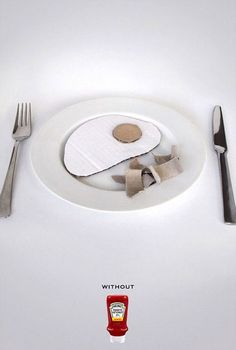 a white plate topped with an egg next to a knife and fork