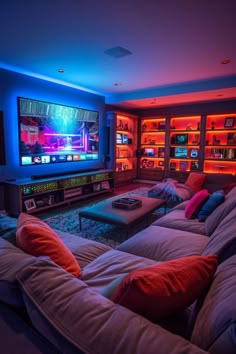 a living room filled with furniture and a flat screen tv sitting on top of a wall