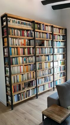 a living room filled with lots of books