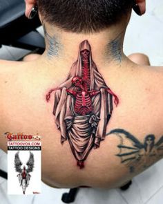 the back of a man's neck with a skeleton and cross tattoo on it