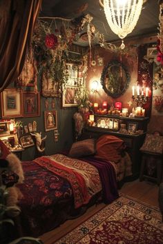 a bedroom decorated with candles and pictures on the wall, lights hanging from the ceiling