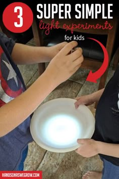 two children are playing with a light up frisbee