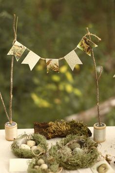 an outdoor display with moss, eggs and bunting