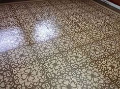 an intricately designed floor in the middle of a room