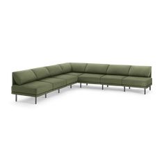 a green sectional couch with metal legs on an isolated white background, viewed from the front