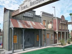 an old building with a sign that says yuma arizona on the front and side