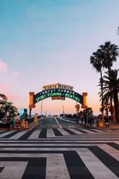 people are standing on the street under an arch that says san francisco beach state park