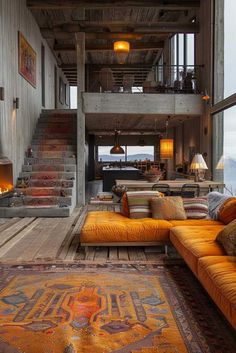 a living room filled with lots of furniture next to a fire place in the middle of a building