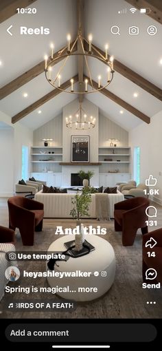 a living room filled with furniture and a chandelier hanging from the ceiling above it