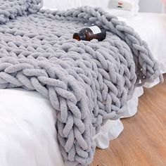 a blanket that is on top of a bed