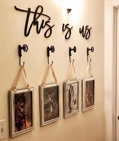 there are four pictures hanging on the wall and one has a couple's initials