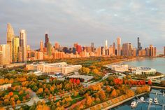 an aerial view of the chicago skyline and lake michigan, with boats in the foreground