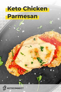 the cover of keto chicken parmesan on a black plate with parsley