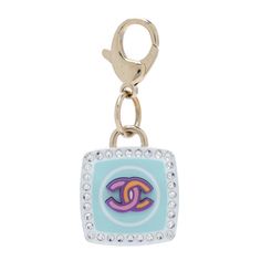 This is an authentic CHANEL Metal Resin Crystal CC Key Ring Bag Charm in Gold and Multicolor. This lovely blue enameled charm features a gold CC logo in the middle and gold around the edges, affixed to a CC engraved lobster clasp. Chanel Charms, Jewelry Accessories Ideas, Ring Bag, Accessories Ideas, Handbag Wallet, Cc Logo, Wallet Accessories, Bago, In The Middle