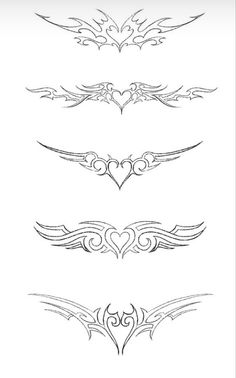 a set of ornate design elements for tattoos or other designs, including wings and hearts