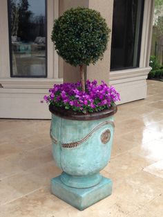 a potted planter with purple flowers in it