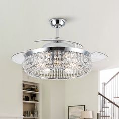 a chandelier hanging from the ceiling in a living room