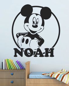 a mickey mouse wall decal with the word noah