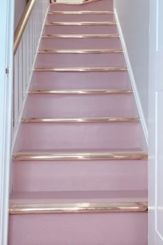 the stairs are painted pink and gold