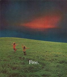 two children running across a green field with the sky in the background and an advertisement for free