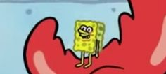 a spongebob is standing in the middle of a hand that has something on it