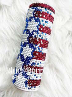 a red, white and blue beaded can cooler